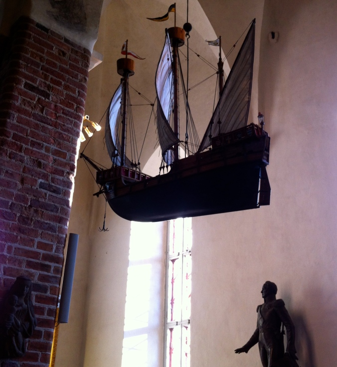 A boat hangs inside the church
